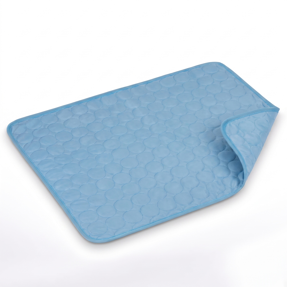 Light blue quilted pet cooling mat with darker blue bound edge on a white background