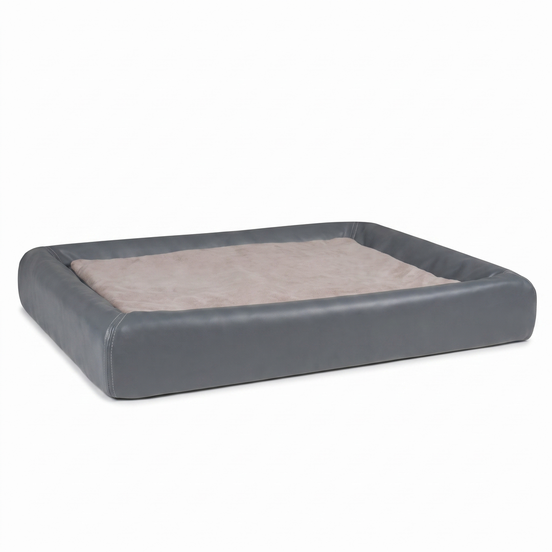 Orthopedic dog bed in grey vegan leather with plush sleep cushion on white background