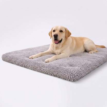 Labrador relaxing on a grey memory foam dog mat with plush noodle chenille cover