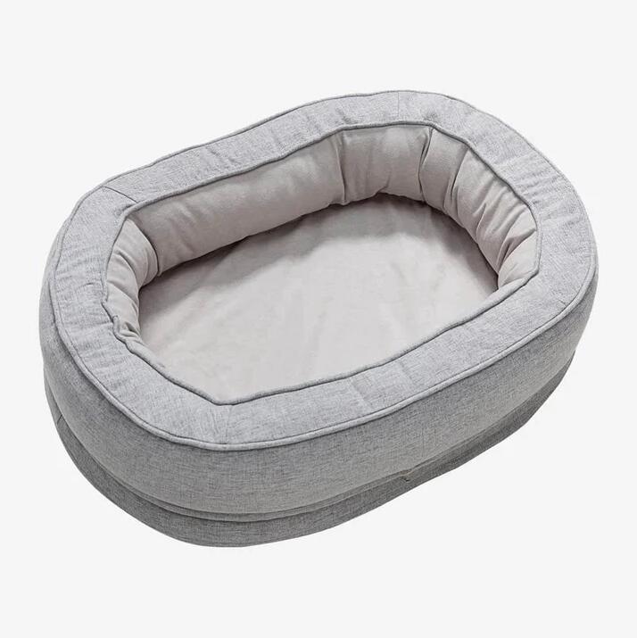 Light Grey oval bolster pet bed, washable cover