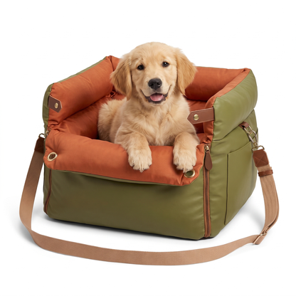 Dog car seat travel bed in olive leather look with orange cushion and a golden retriever puppy inside