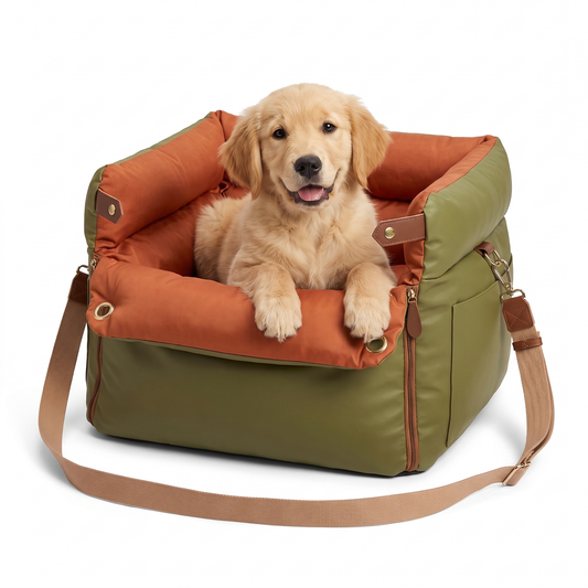 Dog car seat travel bed in olive leather look with orange cushion and a golden retriever puppy inside