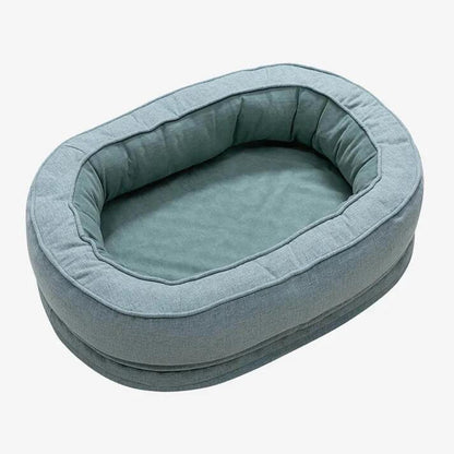 Teal oval bolster pet bed, washable cover