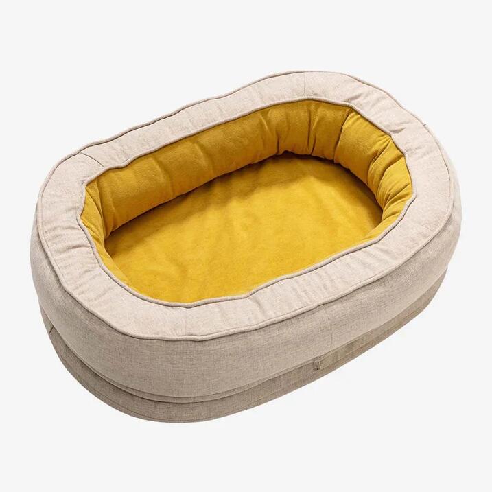 Yellow oval bolster pet bed, washable cover