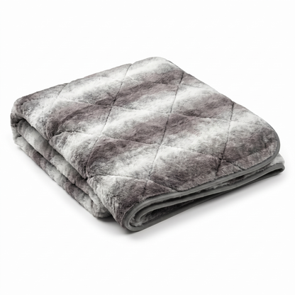 Folded luxury grey faux fur dog blanket throw with quilted diamond stitching on white background