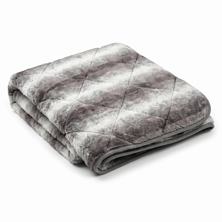 Folded luxury grey faux fur dog blanket throw with quilted diamond stitching on white background