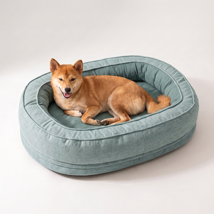 Dog resting in a teal machine washable donut dog bed