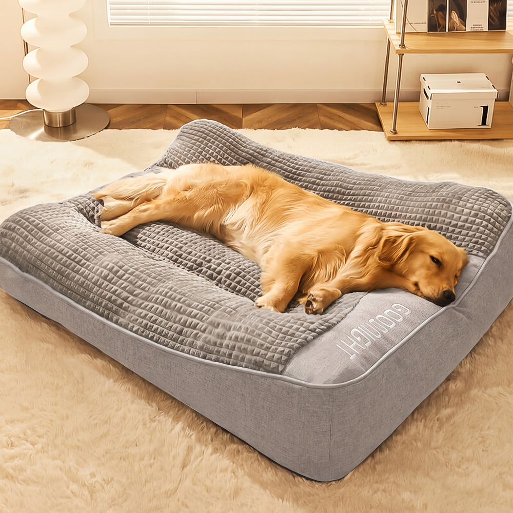 Grey orthopaedic dog sofa bed with bolster and headrest, golden retriever asleep