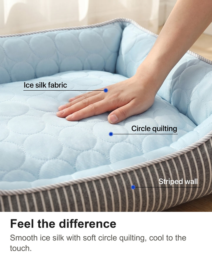 Hand resting on the cool ice silk quilted top of the cooling dog bed