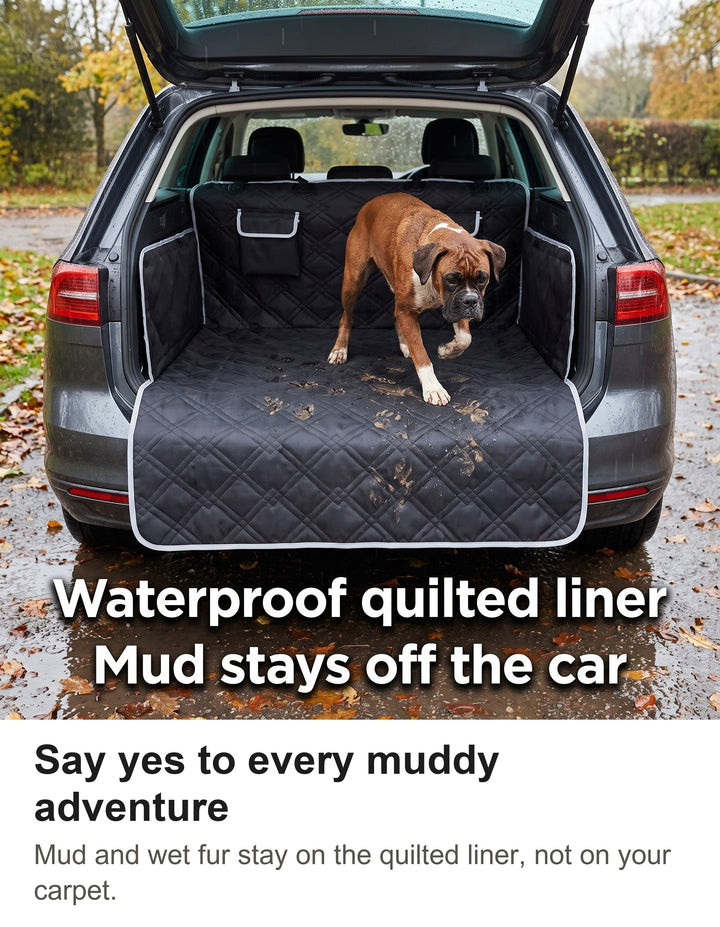 Muddy Boxer in a car boot fitted with the black waterproof dog boot liner