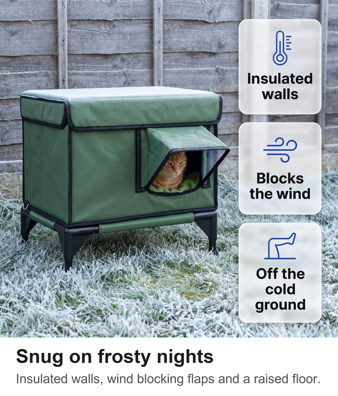 Ginger cat curled up inside the insulated outdoor cat shelter on a frosty lawn