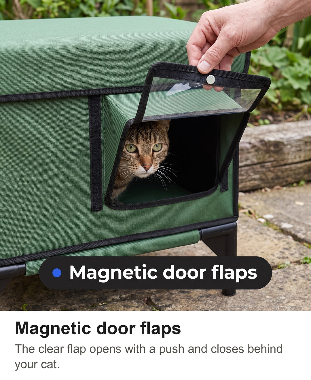 Hand lifting the clear magnetic door flap of the outdoor cat house