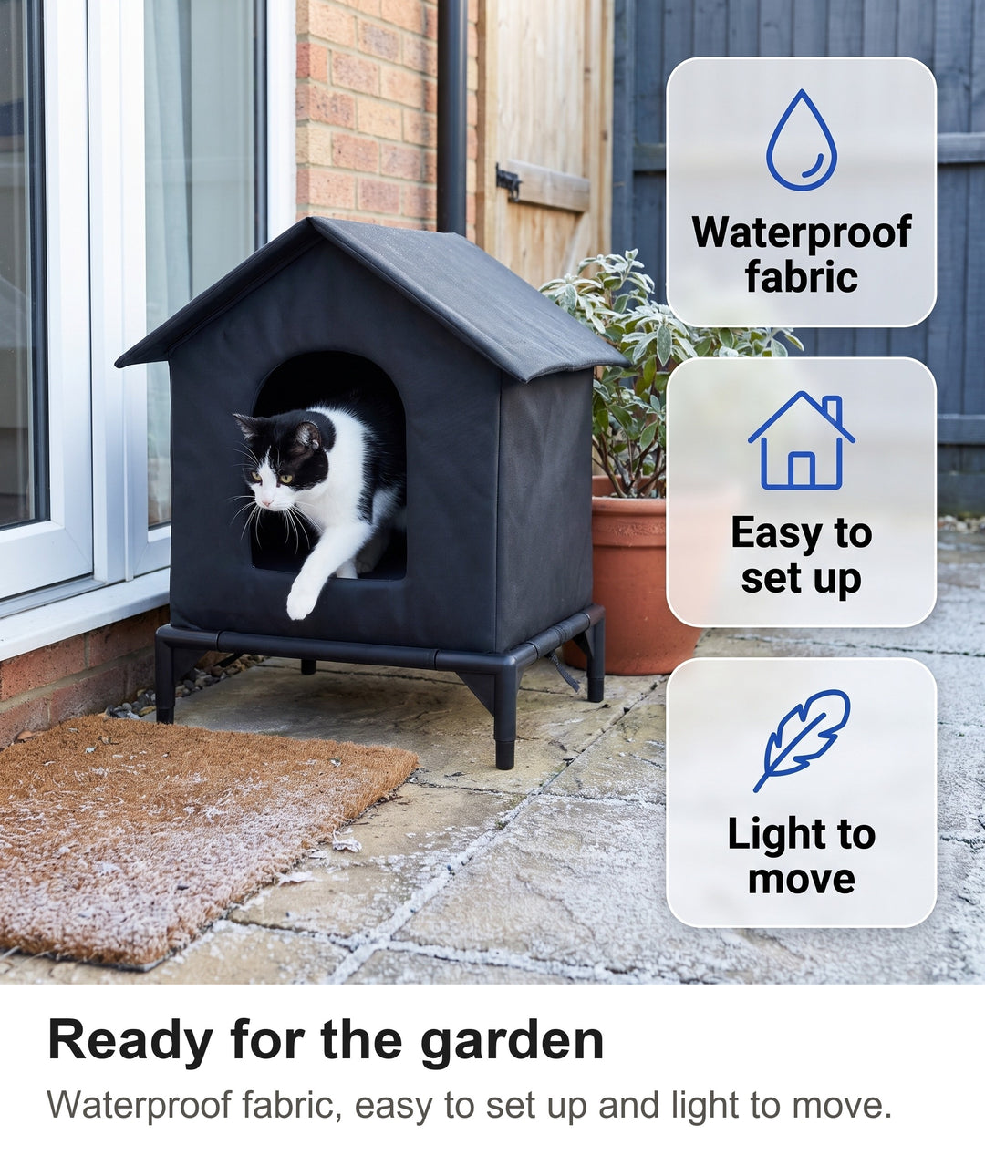 Cat stepping into the black outdoor cat shelter by a back door