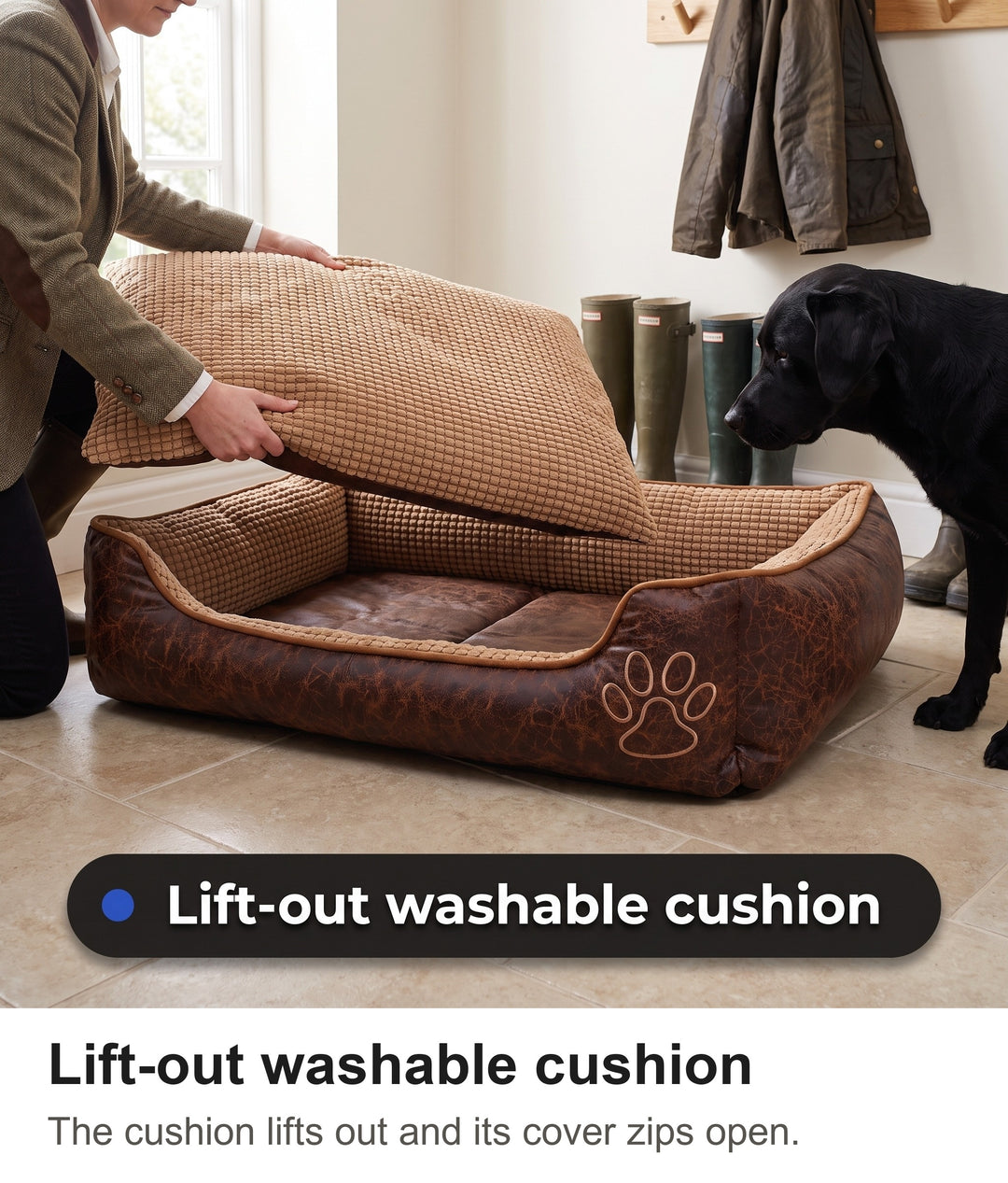 Woman lifting the removable cushion out of the washable dog bed in a boot room