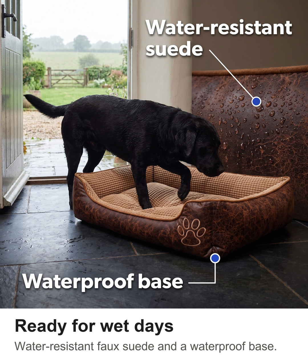 Damp black Labrador stepping into the dog bed on a slate floor after a rainy walk