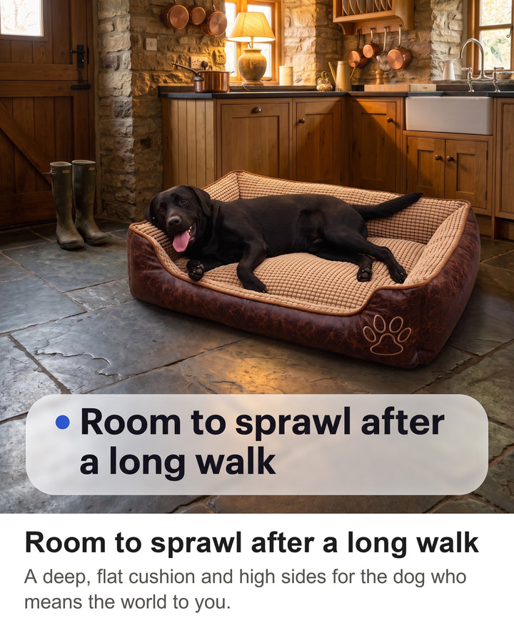 Black Labrador flopped out in the dark brown large dog bed after a long walk