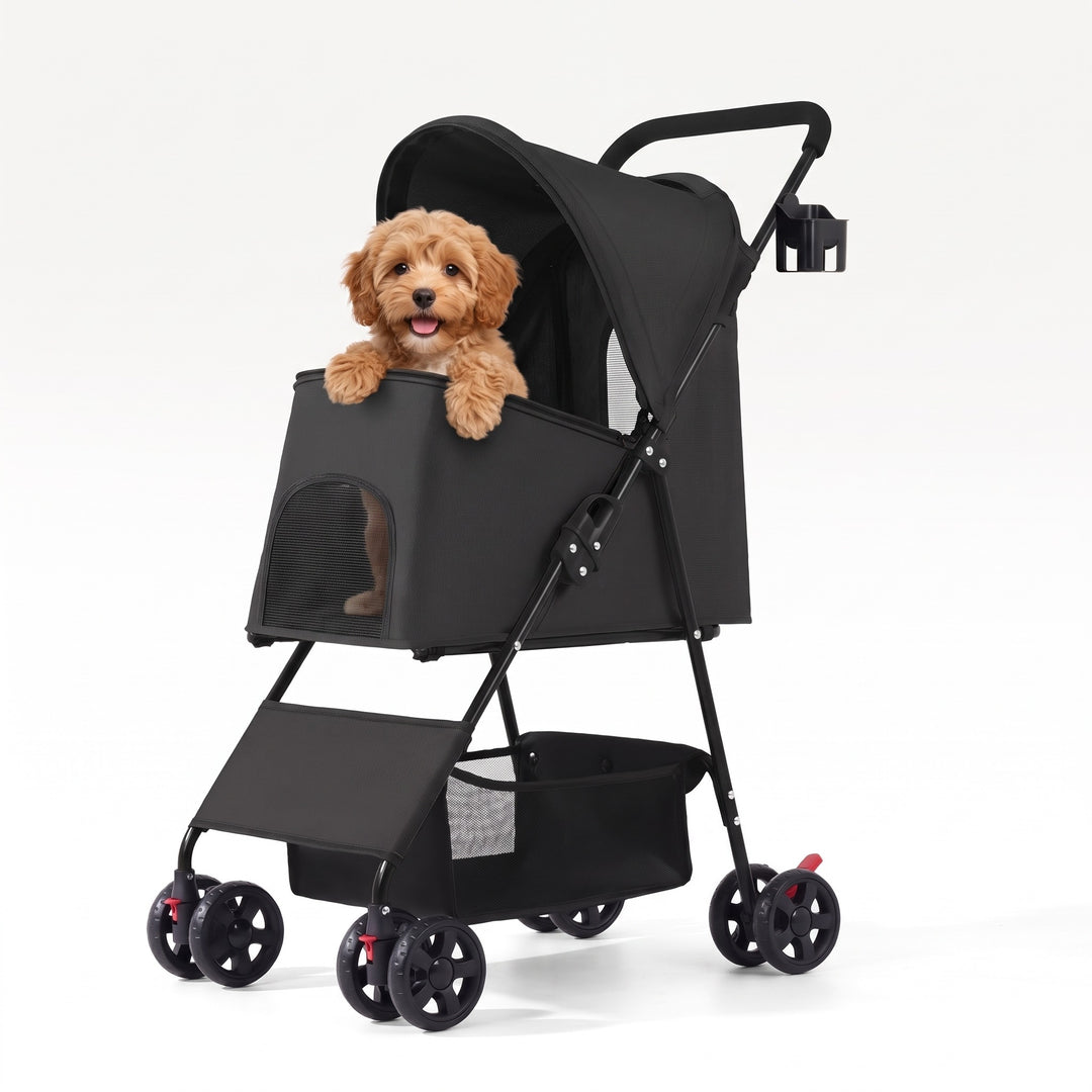 Small dog sitting in the black folding dog pram with mesh canopy and cup holder