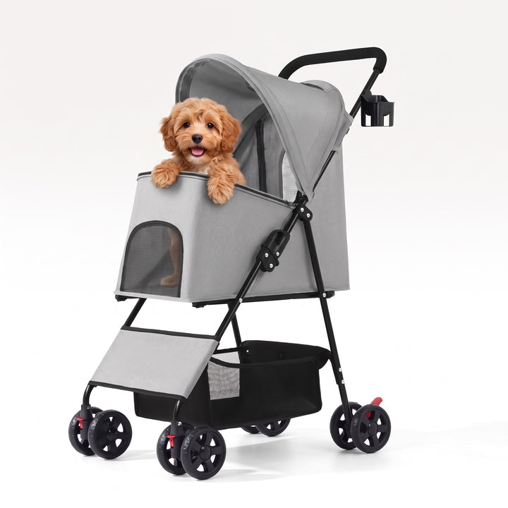 Small dog sitting in the grey folding dog pram