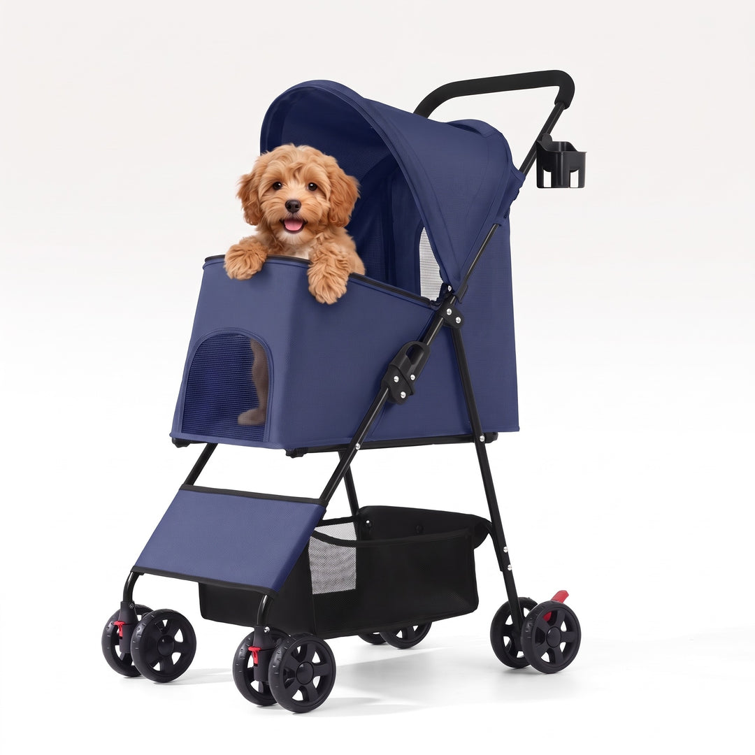 Small dog sitting in the navy blue folding dog pram