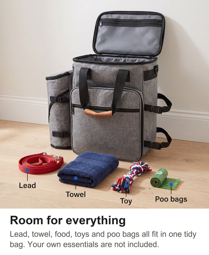 Dog walking bag open with a lead, towel, toy and poo bags laid out beside it to show what fits inside