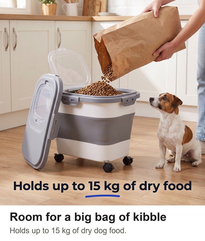Pouring a bag of dry dog food into the 15 kg food storage container