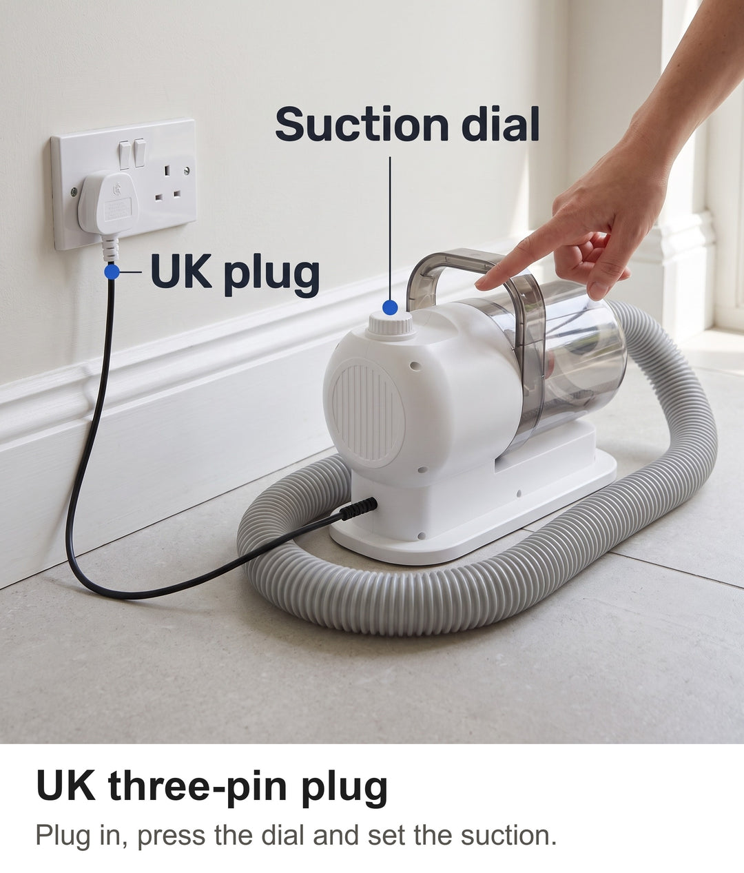 Grooming vacuum plugged into a UK wall socket with its three-pin plug and suction dial