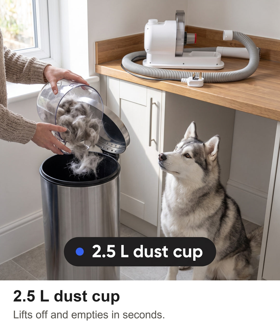 Woman emptying dog fur from the 2.5 L dust cup of the dog grooming kit into a bin