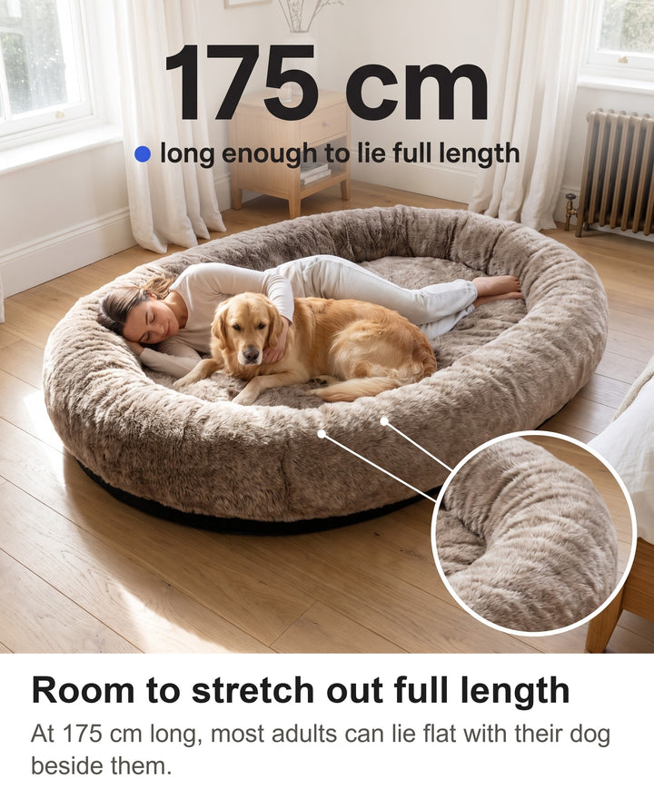 Woman lying full length in the 175 cm giant dog bed with a dog and a zoom on the thick rim