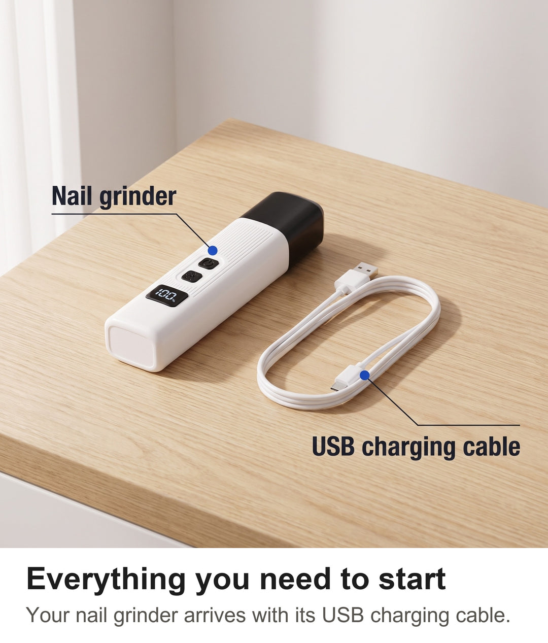 Rechargeable dog nail grinder with its USB charging cable laid out