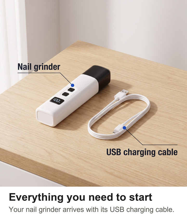 Rechargeable dog nail grinder with its USB charging cable laid out