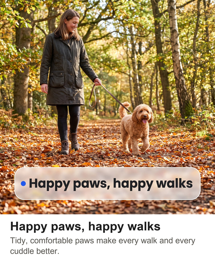 Woman walking a Cockapoo on a woodland path with neat paws