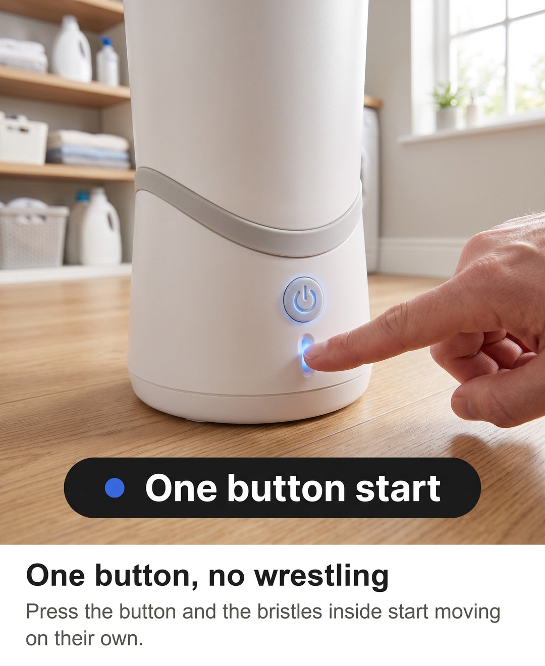Finger pressing the one button start on the white automatic dog paw washer
