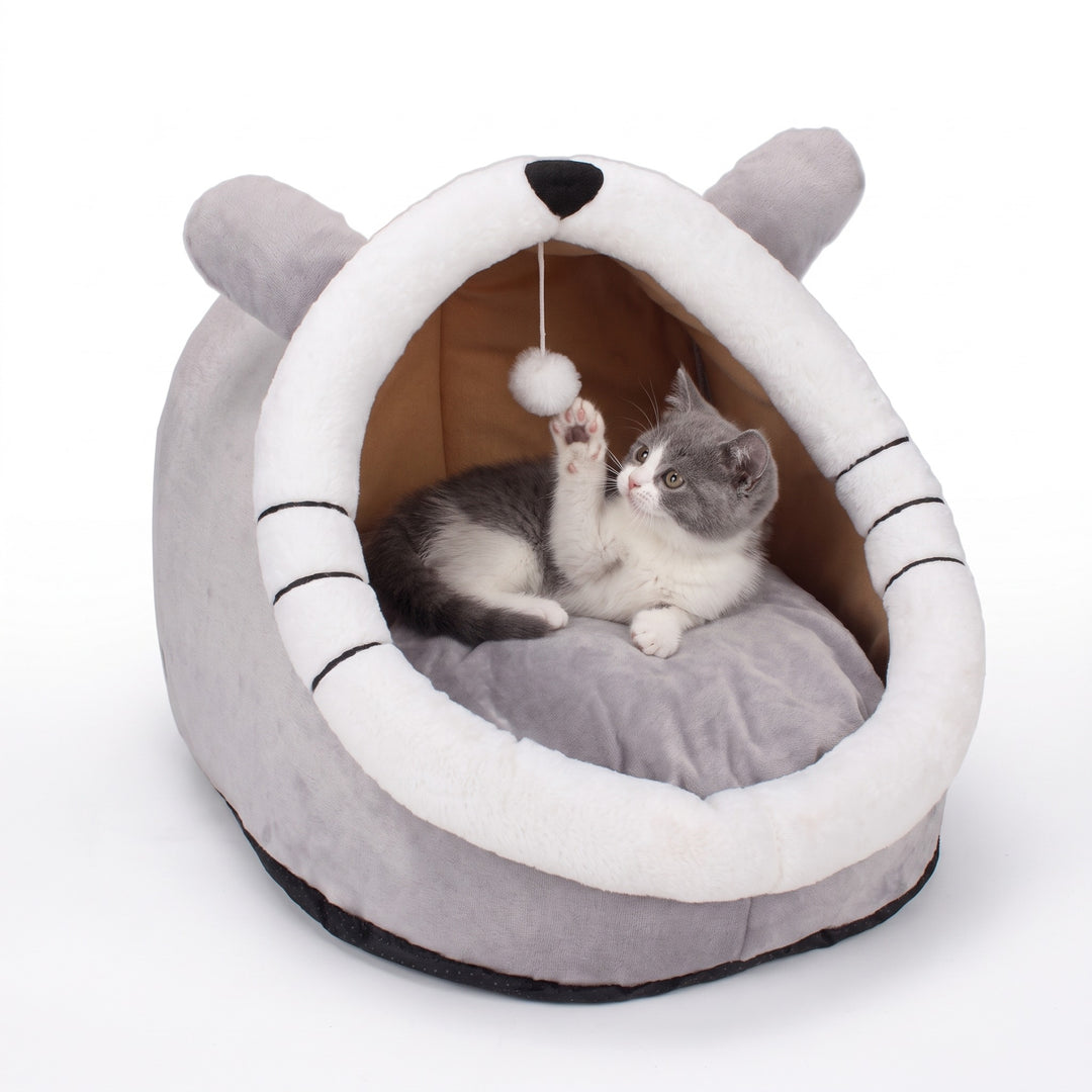 Whisker Face cat cave bed with ears and pompom toy, grey and white kitten inside