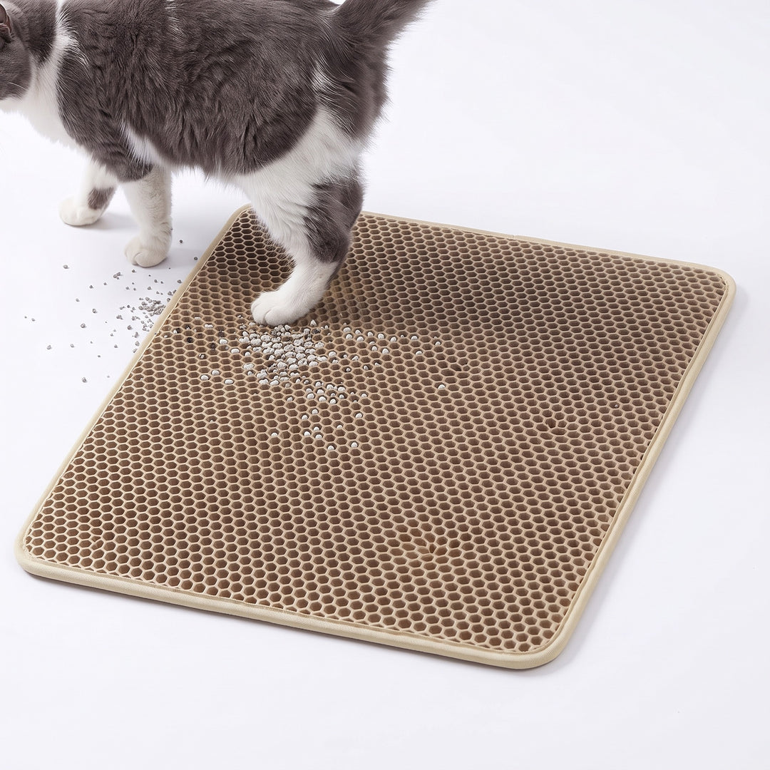 Beige double layer cat litter mat with a cat stepping off it