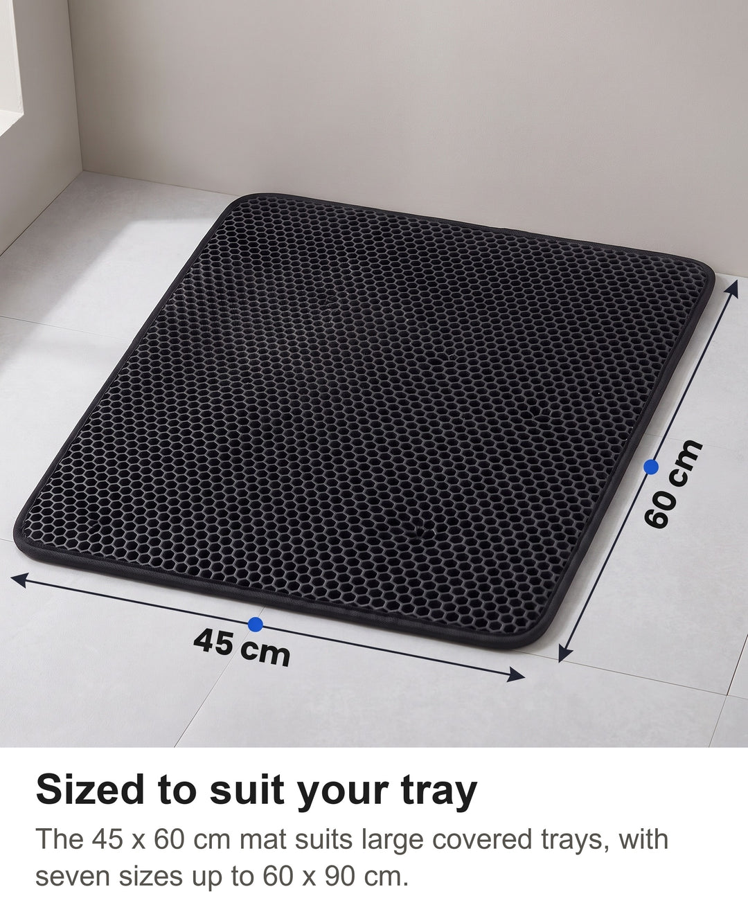 Black honeycomb cat litter mat in size 45 by 60 cm with its size marked