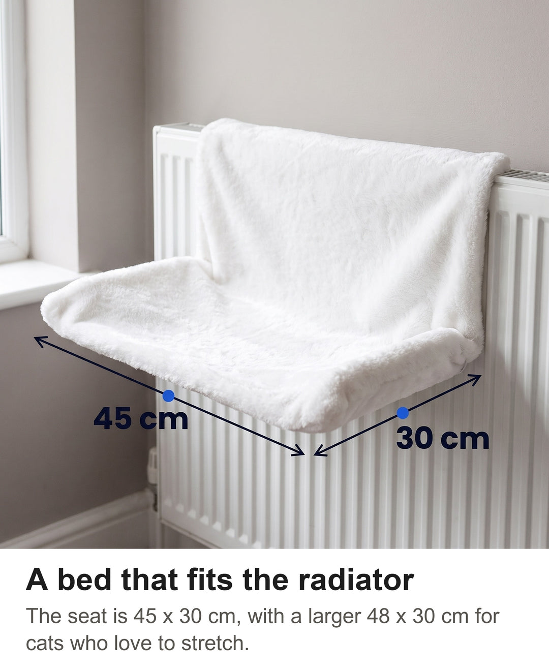 White plush cat radiator bed with its size marked: 45 cm long and 30 cm deep
