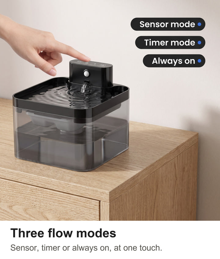 Finger touching the control panel of the cat drinking fountain with sensor, timer and always-on modes