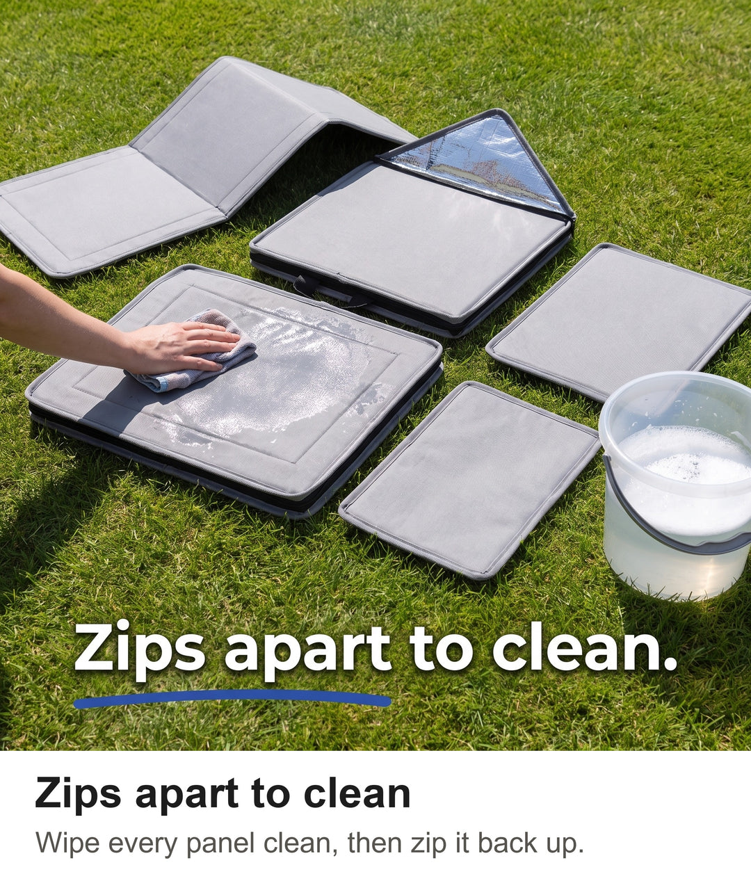 Outdoor cat house unzipped into panels on a lawn and wiped clean