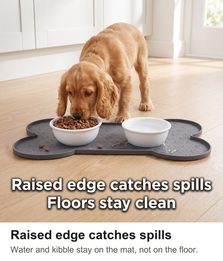 Cocker Spaniel puppy eating from a bowl on the grey silicone dog food mat, spills held by the raised edge