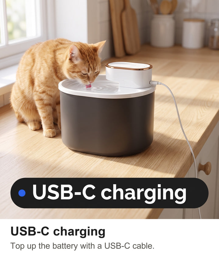 Wireless cat water fountain charging with a USB-C cable on a kitchen worktop
