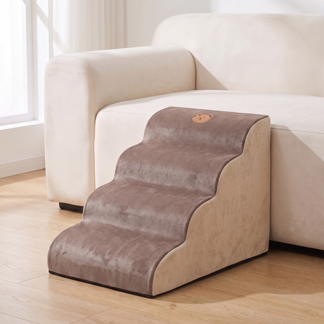 Brown and cream foam dog steps with 4 steps beside a light sofa in a bright living room