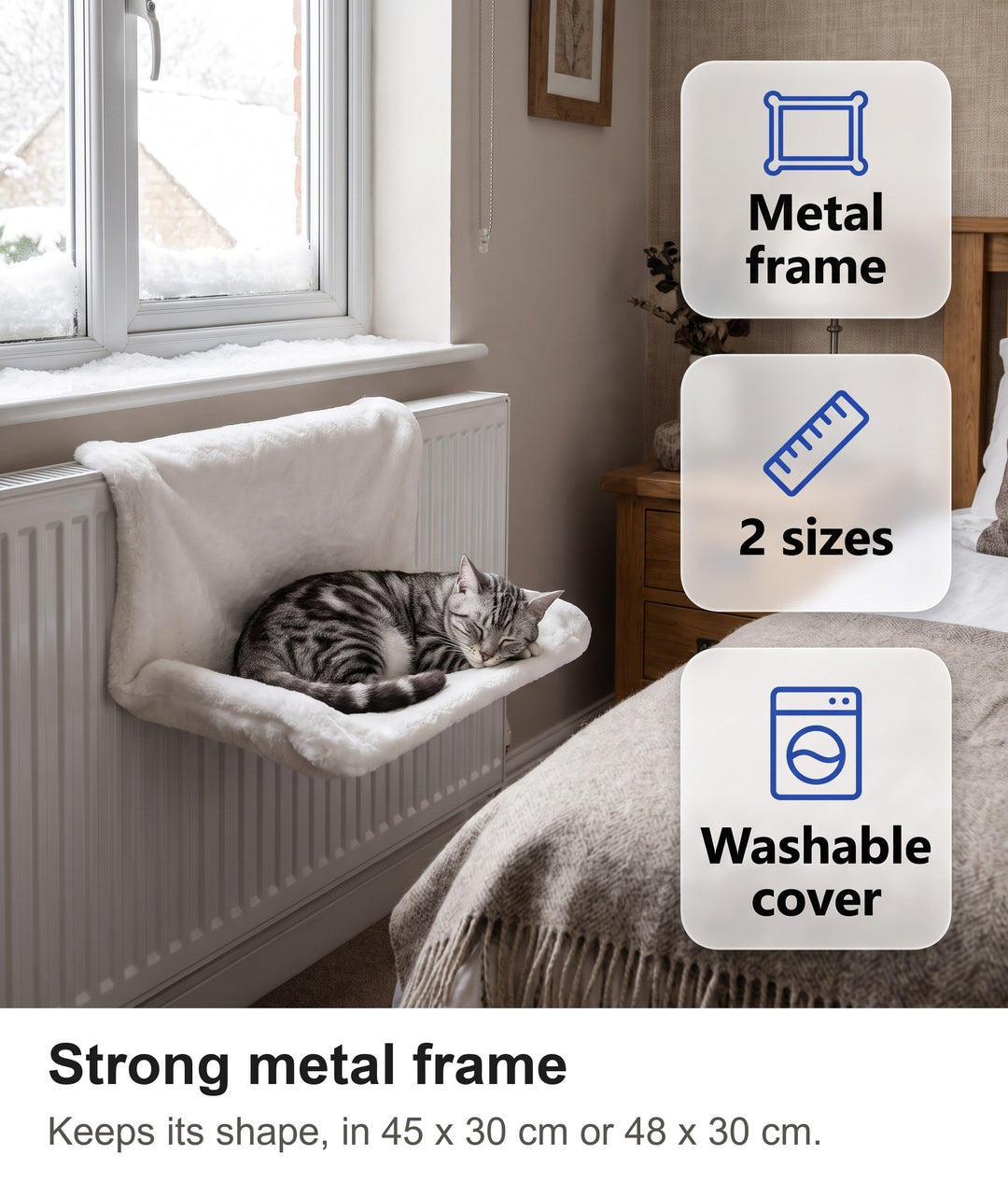 Tabby cat asleep in the radiator bed under a window with snow outside