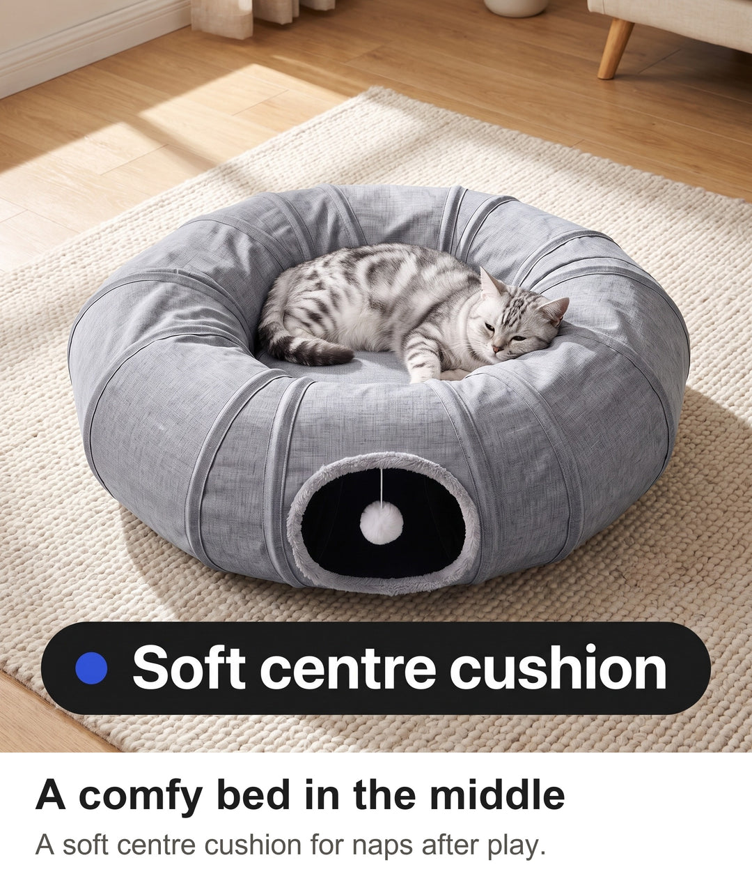 Silver tabby cat asleep on the centre cushion of the cat tunnel bed in a sunny living room