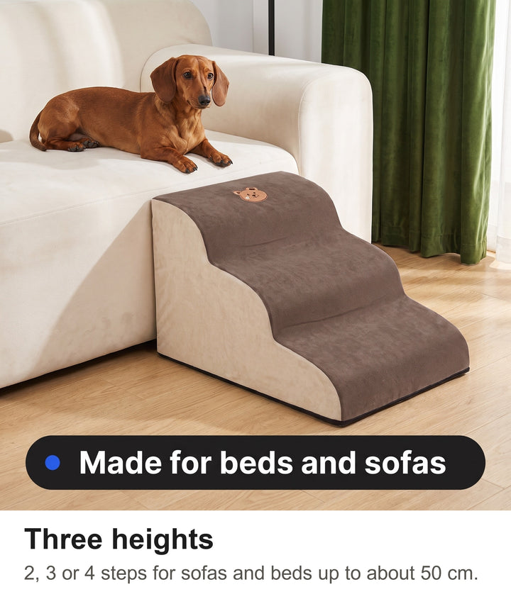 Dachshund resting on a sofa next to the brown foam dog stairs