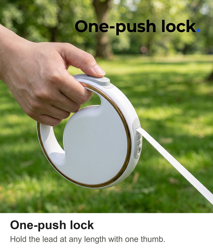 Thumb sliding the one-push lock on the retractable dog lead handle