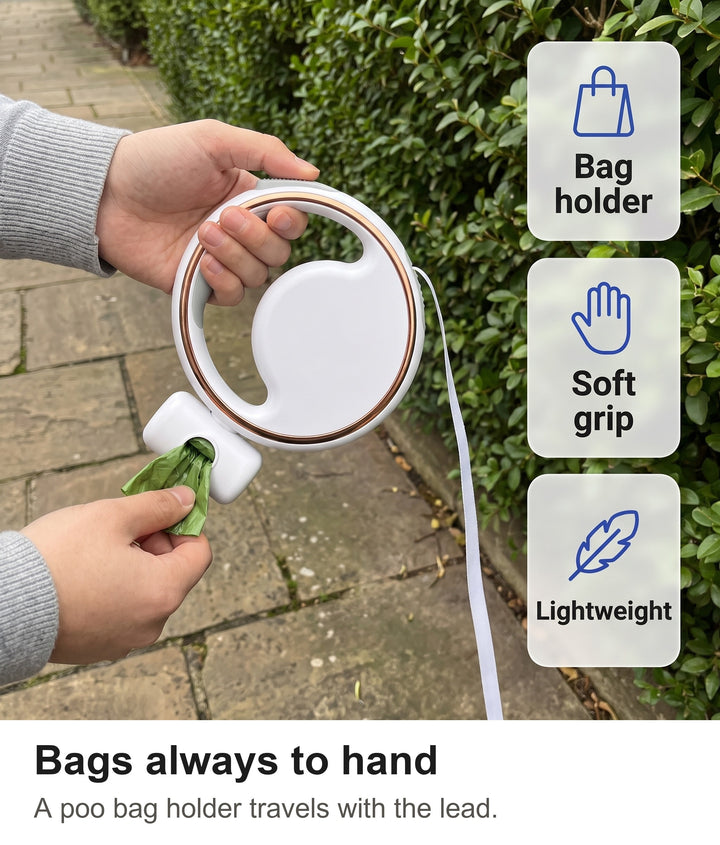 Pulling a poo bag from the bag holder on the retractable dog lead