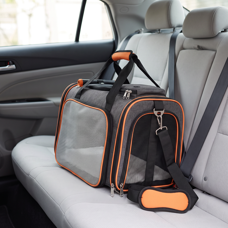 cat carrier with expandable mesh sides sling strap and soft mat in use