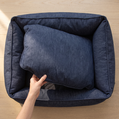 b2 reversible cushion: overhead view of the inner cushion turned over and the near corner lifted, empty base showing ben