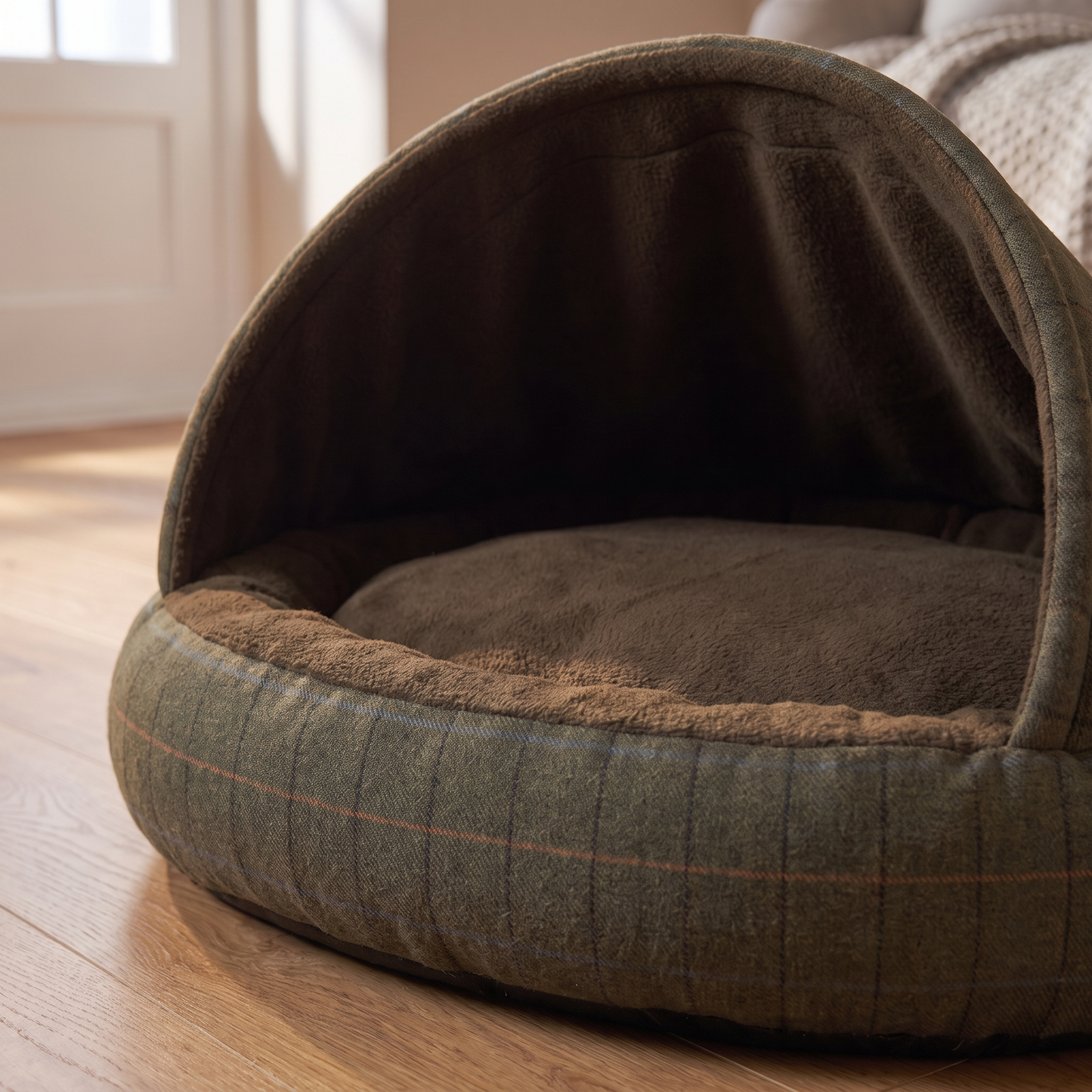b2 cosy materials: green tweed outside meeting brushed brown fleece inside, with the structured hood holding its arch an