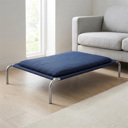 raised dog bed with elevated cool air frame and padded cushion in use